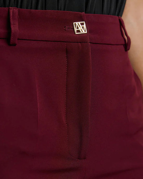 Wide-leg pants with a monogram button